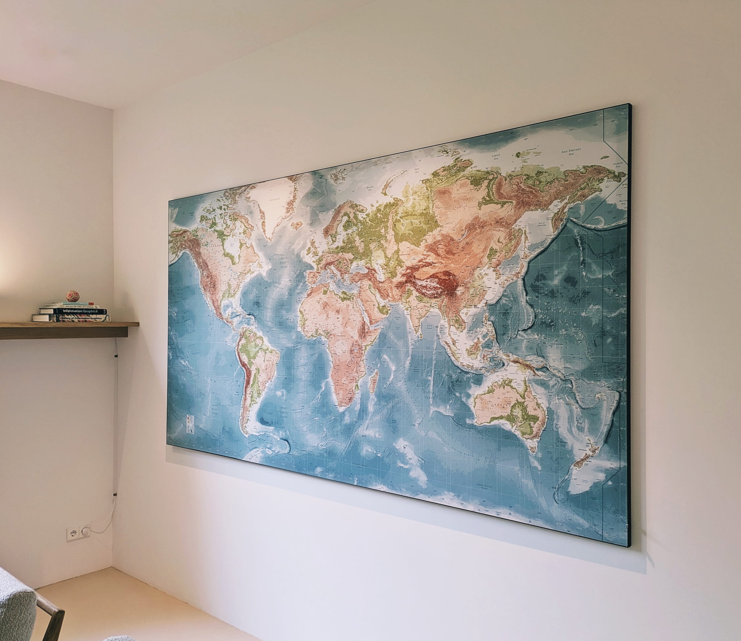 The full map of the world hanging on the wall